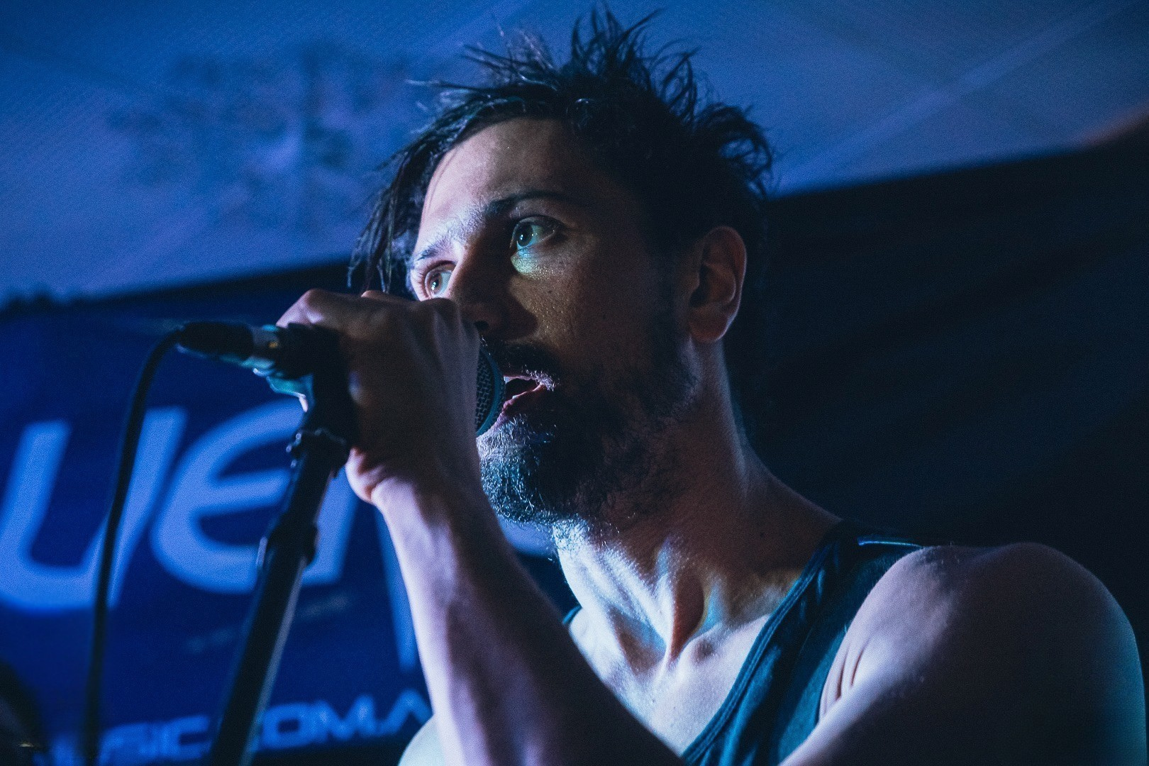 Joey Bazzano singing into the microphone